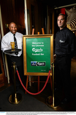 From left: John Barnes serves up to Jason McAteer in 37 Dawson Street recently to highlight for fans Carlsberg's Premier League sponsorship for the next three years.